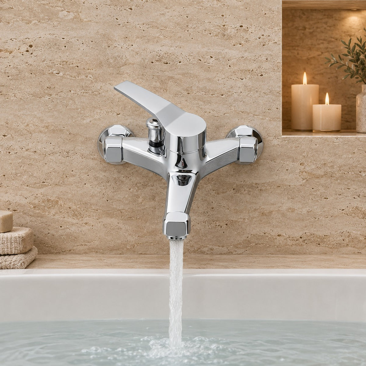 Mitigeur bain-douche mural VELARIO vu de face sur un mur en travertin, mise en situation